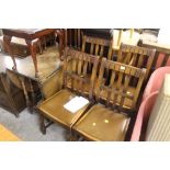 AN OAK DROP LEAF TABLE AND FOUR CHAIRS