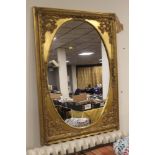 A LARGE GILT FRAMED MIRROR