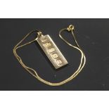 A SMALL GOLD 9CT INGOT AND CHAIN