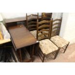 AN OAK DROP LEAF TABLE AND FOUR CHAIRS