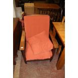 A LARGE OAK FRAMED ARM CHAIR