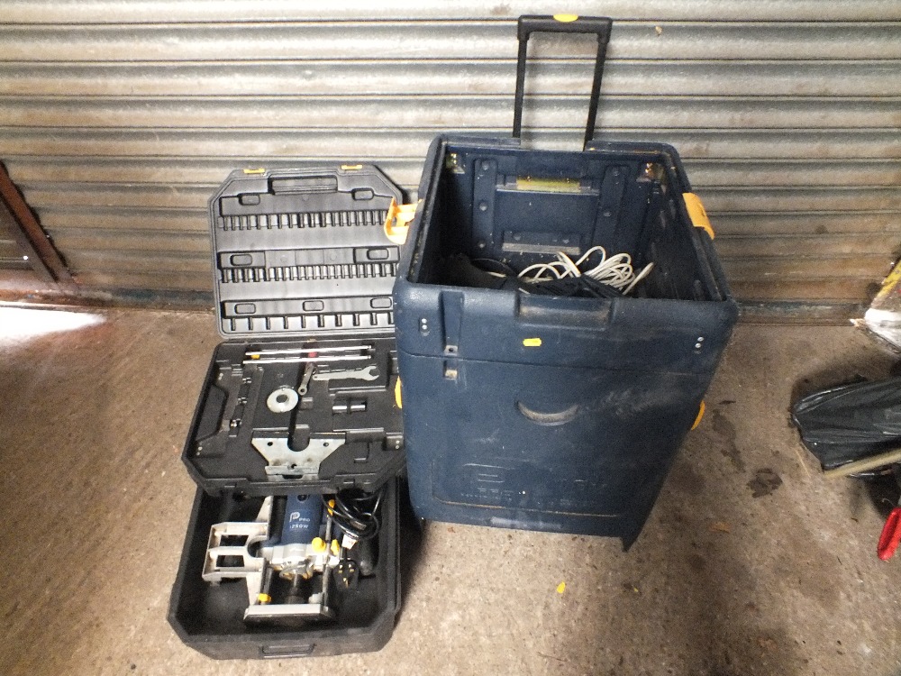 A PERFORMANCE POWER PRO CASED DRILL WITH LARGE TROLLEY WITH SET OF LADDERS ETC.