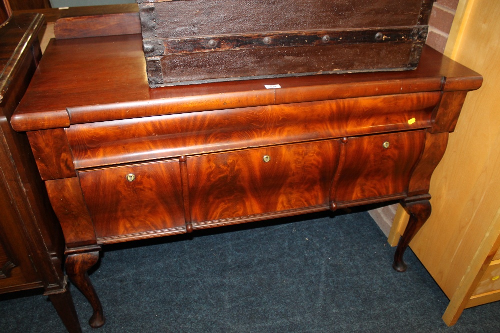 A FOUR DRAWER SIDEBOARD