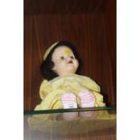 A VINTAGE ROLLER EYE DOLL