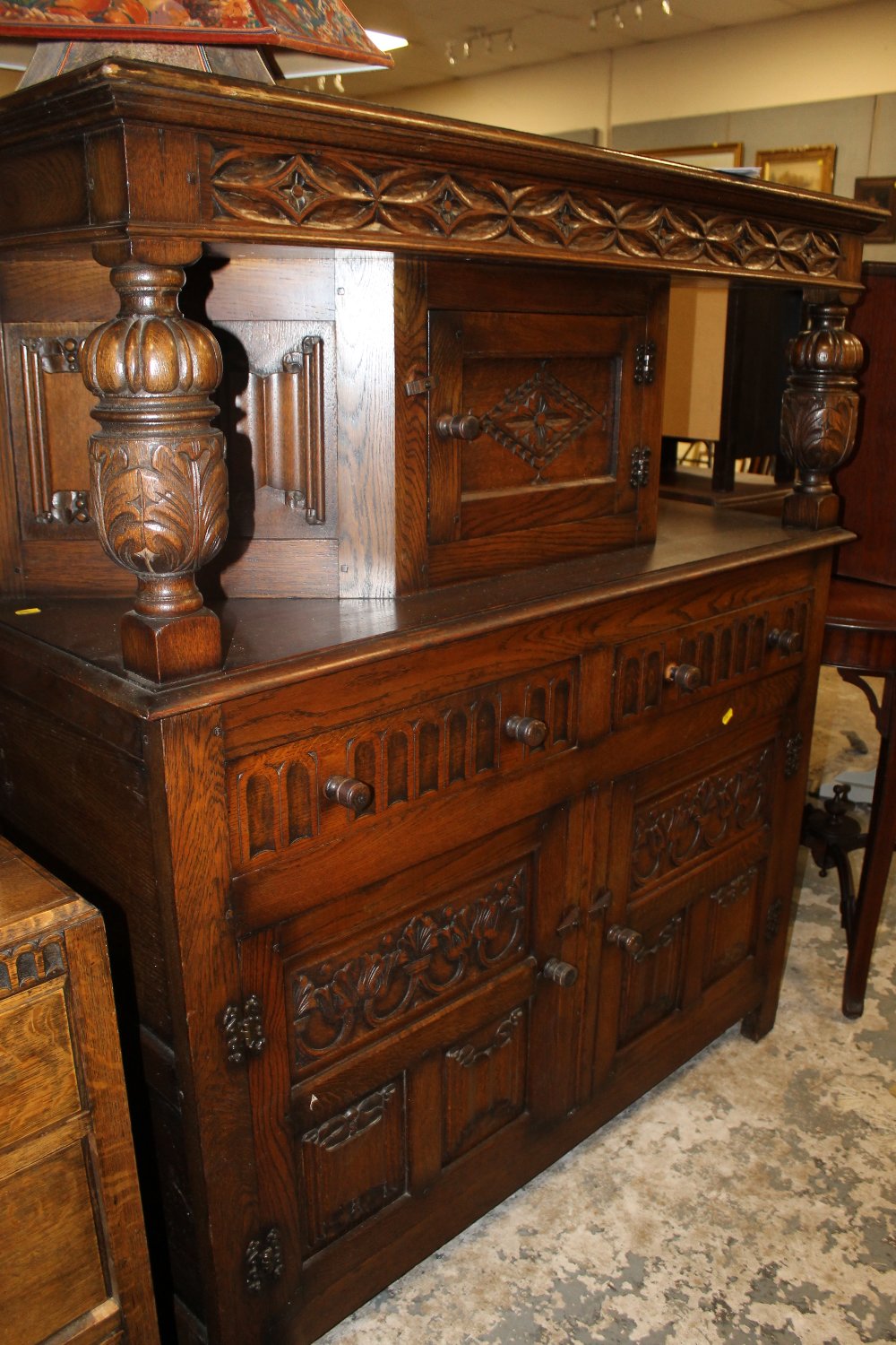 A CARVED OAK COURT CUPBOARD