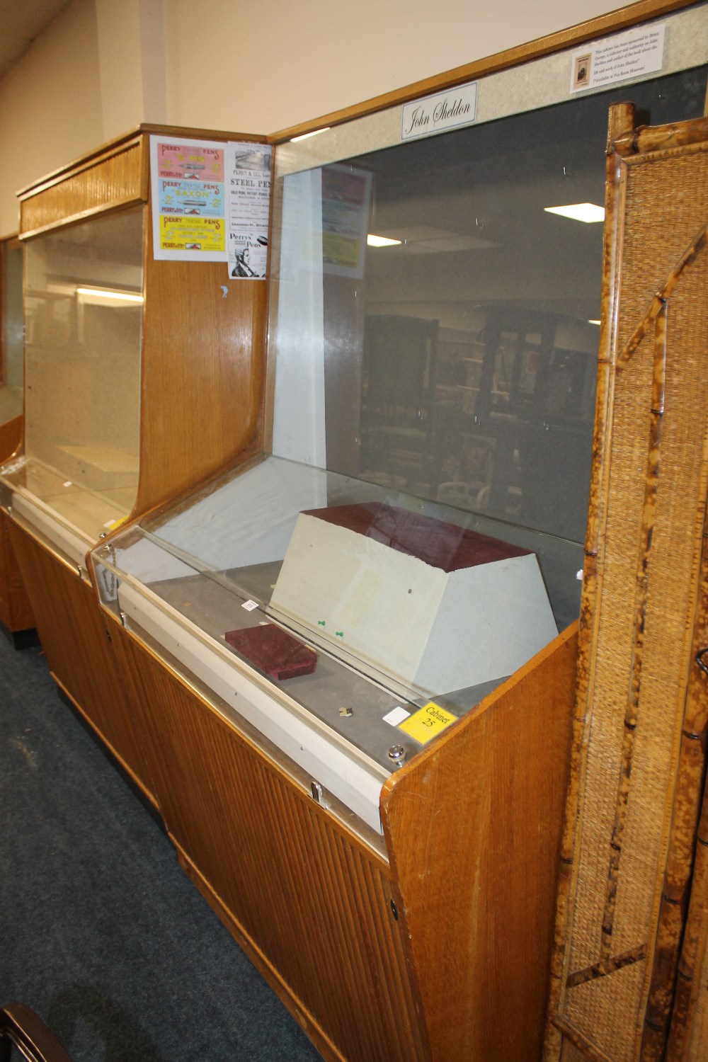 A TALL GLAZED DISPLAY CABINET - FROM BIRMINGHAM PEN MUSEUM