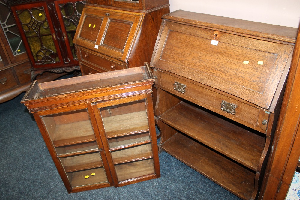 AN OAK MATCHED BUREAU BOOKCASE