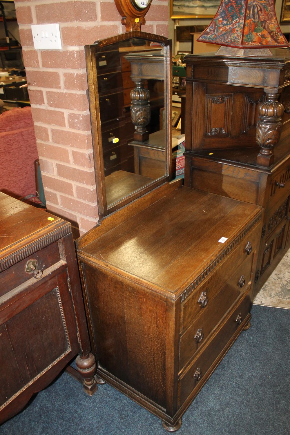 AN OAK DRESSING TABLE OF SMALL PROPORTIONS