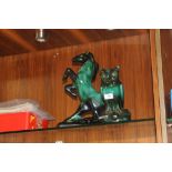 A PAIR OF BLACK & GREEN GLAZED ANIMAL FIGURES - A REARING HORSE & AN OWL