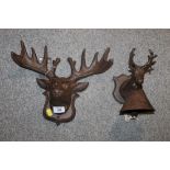 A CAST STAGS HEAD WALL PLAQUE TOGETHER WITH A CAST DEER BELL