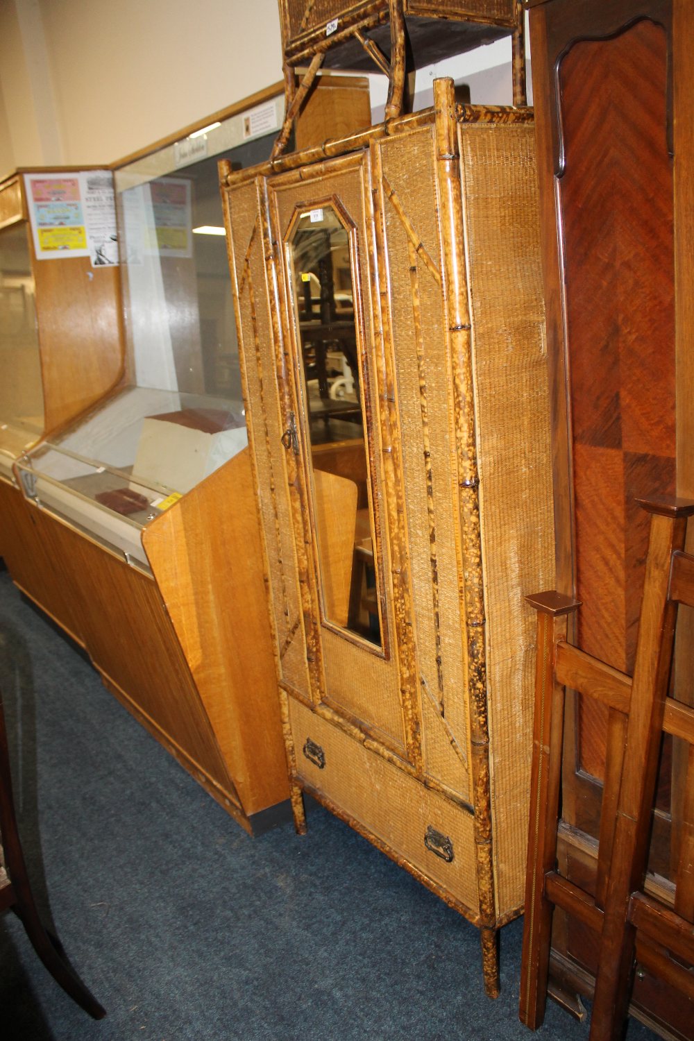 A MIRRORED BAMBOO WARDROBE