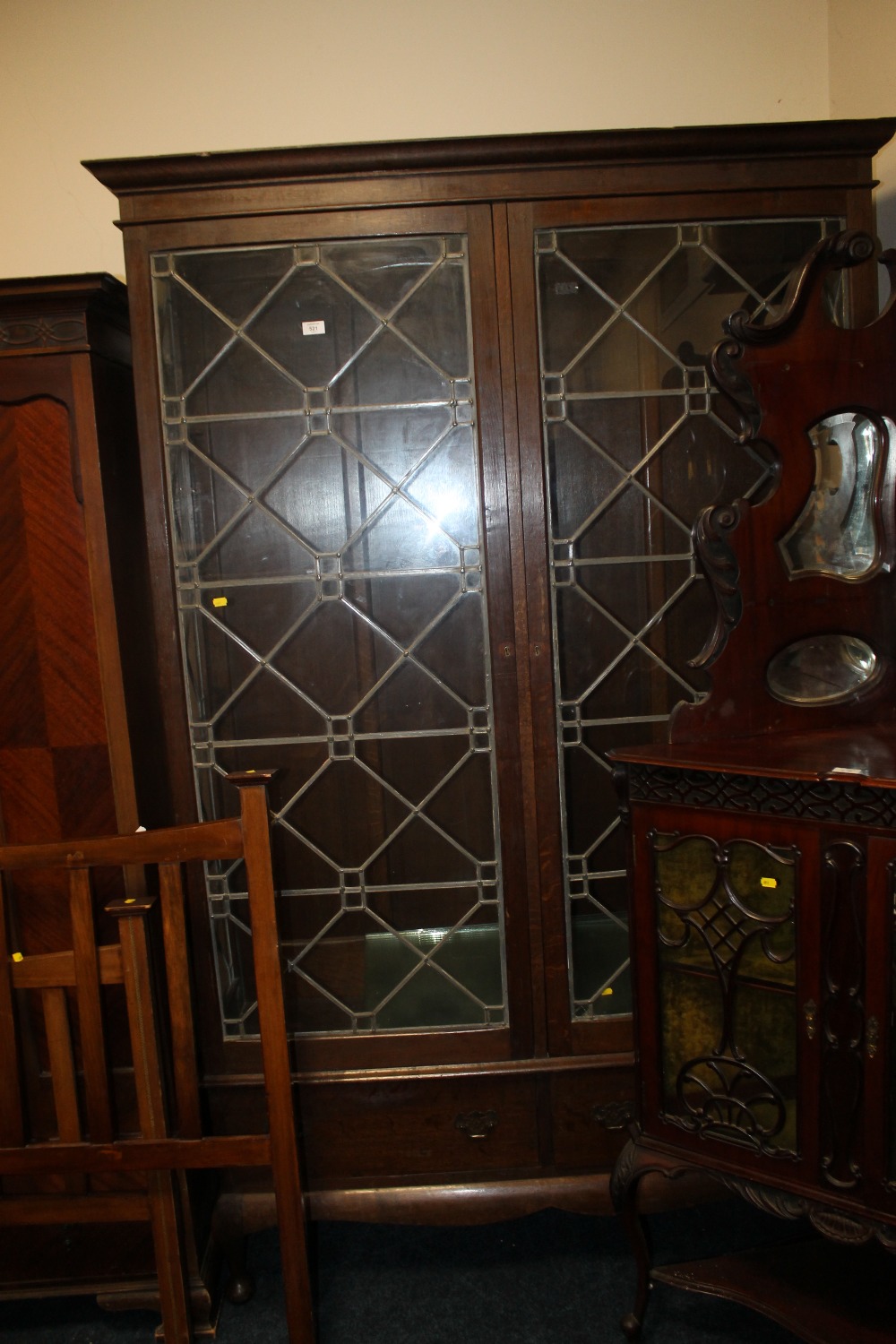 A LARGE OAK CHIPPENDALE STYLE LEAD GLAZED BOOKCASE