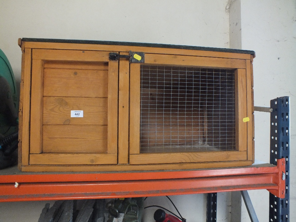 A WOODEN RABBIT HUTCH