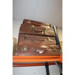 FOUR VINTAGE LEATHER SUITCASES