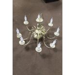 A BRASS CHANDELIER WITH DECORATIVE CANDLE STYLE LIGHT BULBS