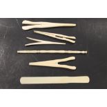 FOUR IVORY GLOVE STRETCHERS, a fan handle and a page turner (6)