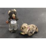 TWO WEST GERMAN CLOCKWORK TOYS, a bear in stripped apron and a kitten with ball (2)