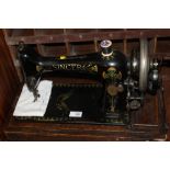 A VINTAGE SINGER SEWING MACHINE