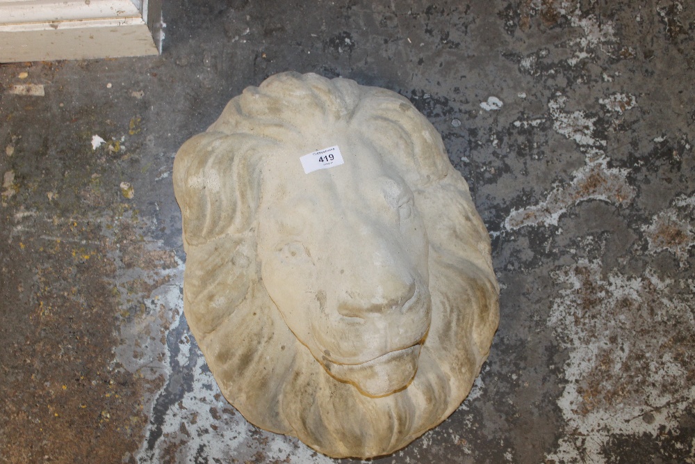 A LARGE STONE MASK OF A LION
