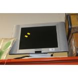 A SMALL FLATSCREEN TV WITH REMOTE