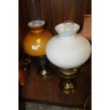 TWO OIL LAMPS WITH GLASS SHADES