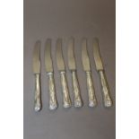 A SET OF SIX HALLMARKED SILVER HANDLED KINGS PATTERN KNIVES