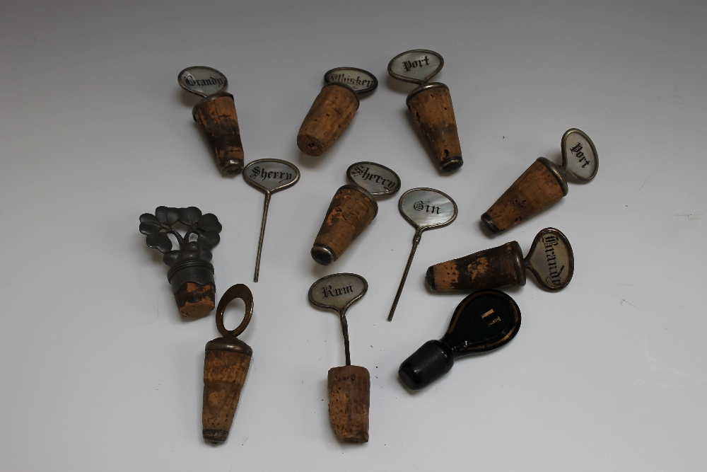 A COLLECTION OF VINTAGE MOTHER OF PEARL BOTTLE STOPPERS, in various styles to include Whiskey, 2 x