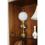 A BRASS OIL LAMP & SHADE