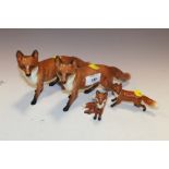 A SET OF FOUR BESWICK FOXES (TWO LARGE & TWO SMALL)