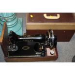 A VINTAGE CASED SINGER SEWING MACHINE