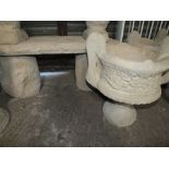 TWO LARGE STONE DECORATIVE TWO HANDLED URNS TOGETHER WITH A STONE TIMBER STYLE SEAT ON LOG PLINTHS