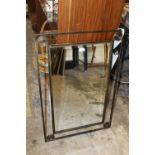 A MODERN BEVEL EDGED METAL FRAMED MIRROR