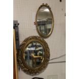 TWO LARGE OVULAR GILT FRAMED BEVEL EDGED WALL MIRRORS