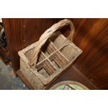 A WICKER SIX BOTTLE CARRY BASKET