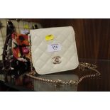A LADIES CHANEL STYLE CLUTCH BAG