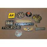 A COLLECTION OF VINTAGE CAR BADGES