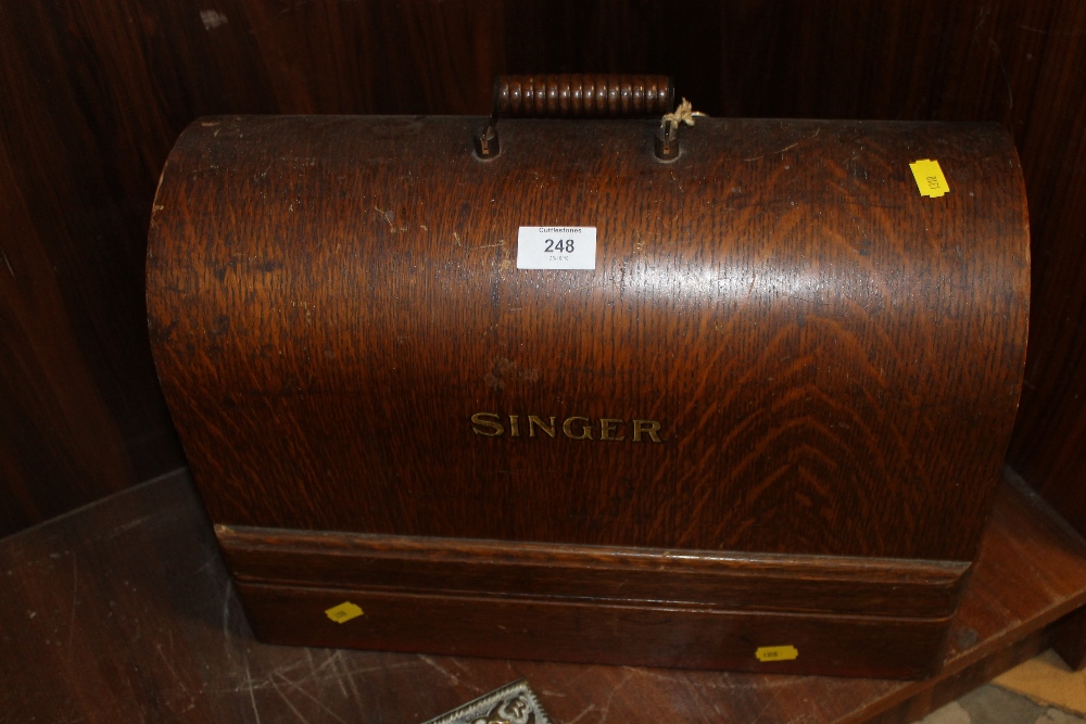 A CASED SINGER SEWING MACHINE