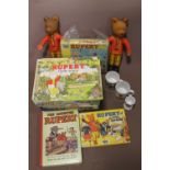 A QUANTITY OF RUPERT THE BEAR RELATED ITEMS, DOLLS, JIGSAW, ANNUALS, POP-UP BOOK ETC