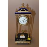 A BLUE AND GILT PORTICO MANTLE CLOCK