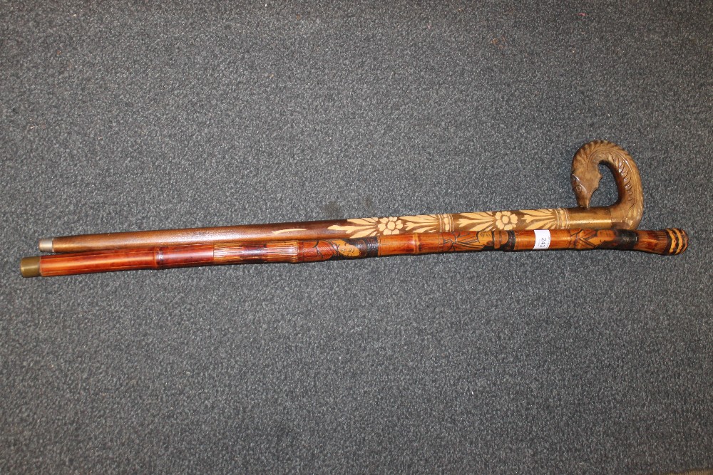 TWO CARVED WALKING STICKS