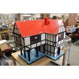 A LARGE VINTAGE TUDOR STYLE WOODEN DOLLS HOUSE (APPROX W 32", D 26.5" H 32 ")