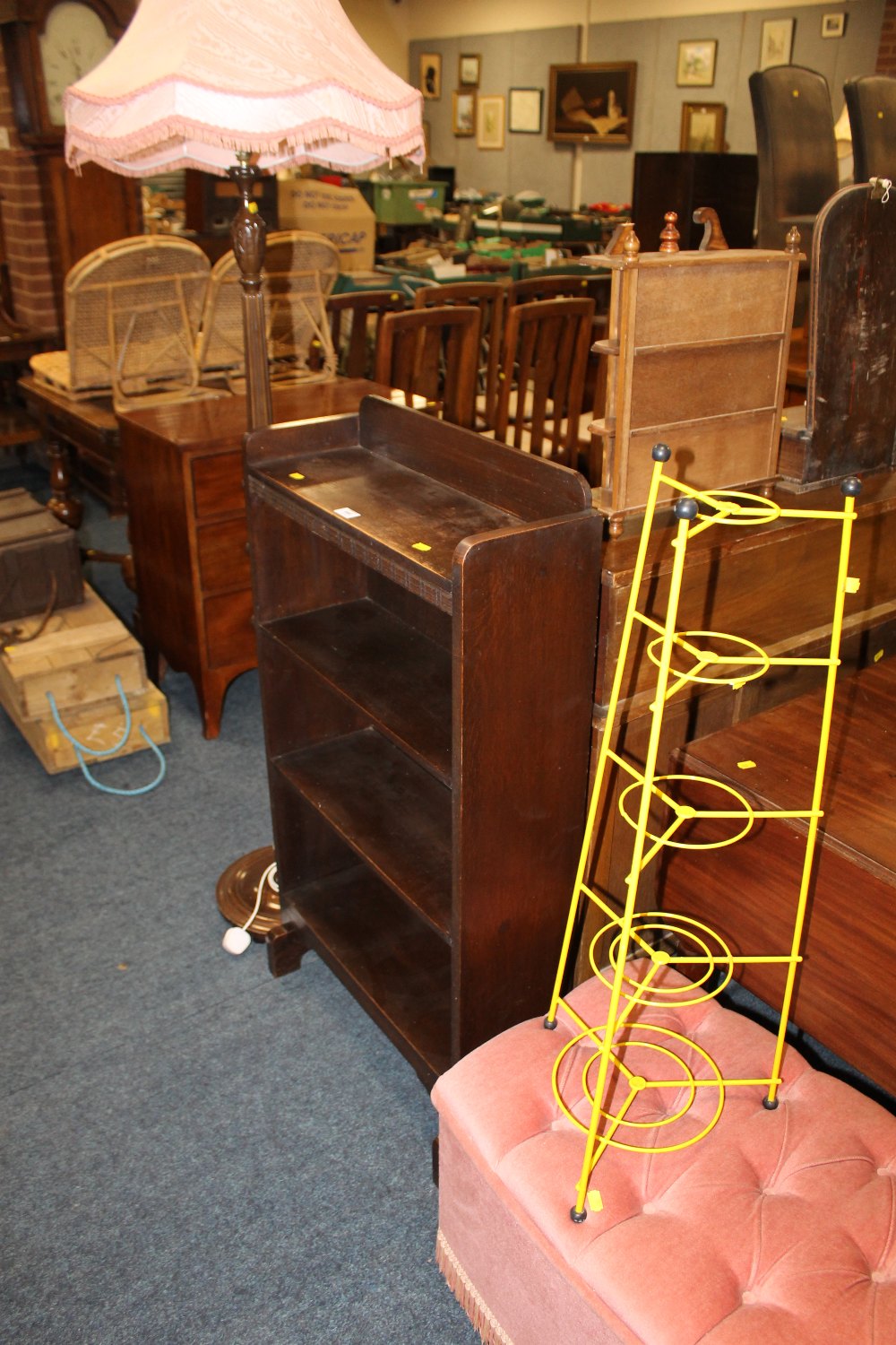 AN OAK OPEN BOOKCASE WITH A STANDARD LAMP, OTTOMAN AND PAN STAND (4)