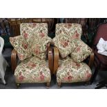 A PAIR OF UPHOLSTERED ARMCHAIRS