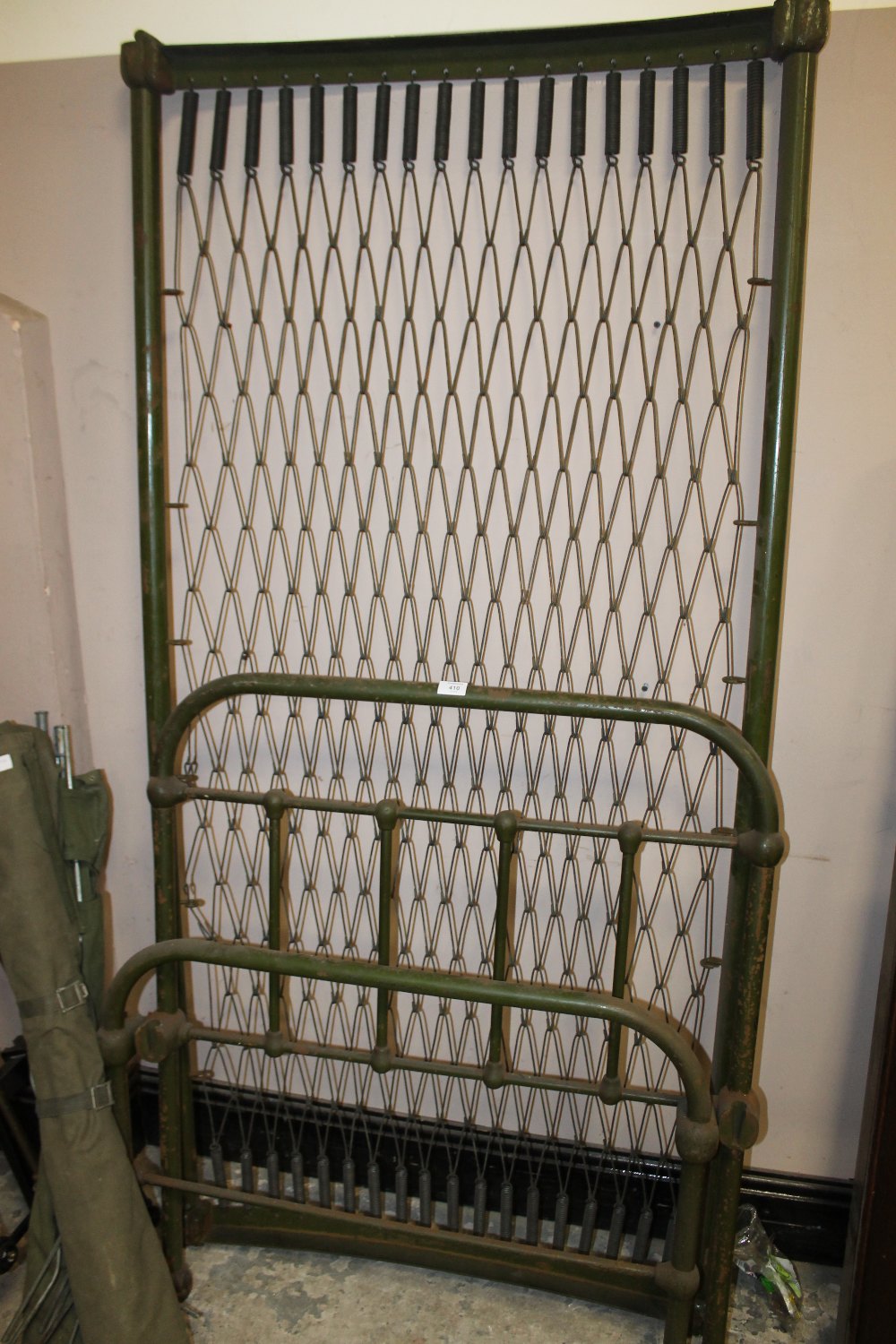 AN ANTIQUE GREEN PAINTED CAST SINGLE BED FRAME