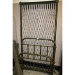 AN ANTIQUE GREEN PAINTED CAST SINGLE BED FRAME