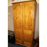 A HONEY PINE DOUBLE WARDROBE