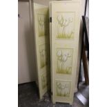 A CREAM PAINTED THREE FOLD SCREEN