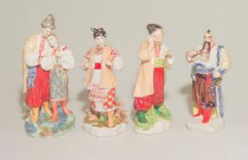 Konvolut Porzellanfiguren,osteuropäische Trachten Weißporzellan partiell vergoldet und Unterglasur