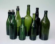 8 Flaschen, 1850-1900 grünes Waldglas, teils modelgeblasen, 3 Flaschen mit passendem