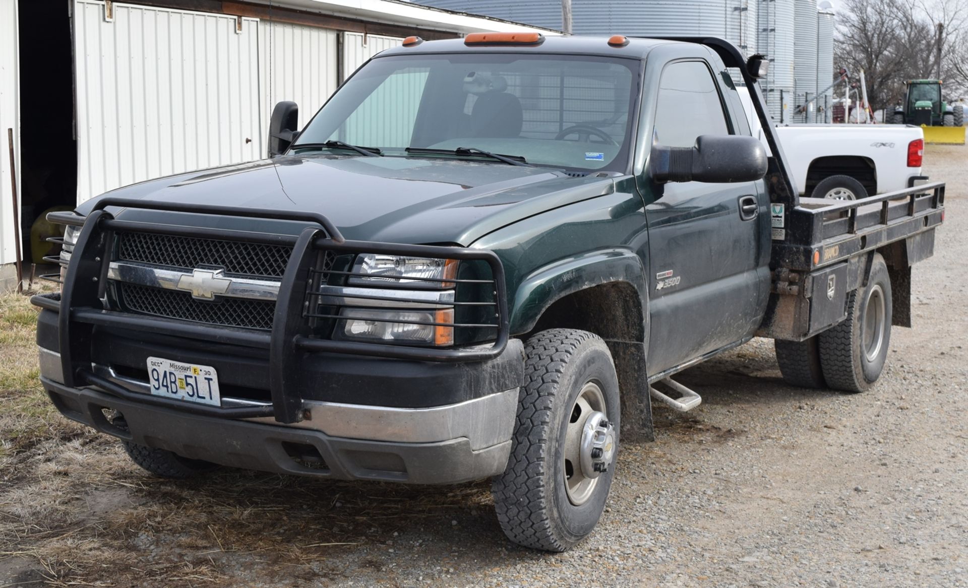 Lot 1076 2004 Chevy 3500 Duramax 4x4 dually flatbed with hydro bale spike, 6-speed manual
